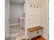 Convenient mudroom entry with built in bench, cubbies and stylish tile flooring at 3076 East Lake Rd, Mcdonough, GA 30252