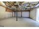 Spacious basement area featuring a concrete floor and open ceiling, perfect for storage or a workshop at 400 Kenny Ln, Temple, GA 30179