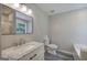 Bathroom featuring a modern vanity with marble countertop, offering a clean and stylish space at 400 Kenny Ln, Temple, GA 30179