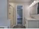 Bathroom featuring a single vanity with marble counters and a door leading to a shower and tub at 400 Kenny Ln, Temple, GA 30179