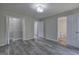 Well-lit bedroom showcasing an en-suite bathroom and walk-in closet, offering privacy and convenience at 400 Kenny Ln, Temple, GA 30179