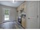 Cozy wet bar featuring stainless steel appliances and a back door that leads to a serene deck at 400 Kenny Ln, Temple, GA 30179