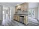 Wet bar with stainless steel appliances, granite countertops, and views of the surrounding landscape through large windows at 400 Kenny Ln, Temple, GA 30179