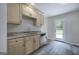 Well-lit kitchenette equipped with stainless steel appliances and a convenient walk-out to an outdoor deck at 400 Kenny Ln, Temple, GA 30179