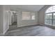 Spacious living room with high ceilings, connecting to other living areas, and large arched window at 400 Kenny Ln, Temple, GA 30179
