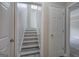 Staircase featuring bright white paint and modern flooring at 400 Kenny Ln, Temple, GA 30179