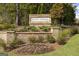 Community sign for Bunn Farms surrounded by lush landscaping and greenery at 292 Oliver Dr, Locust Grove, GA 30248