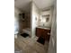 A full bathroom features a shower-tub combo and a vanity with basin sink at 11313 Michelle Way, Hampton, GA 30228