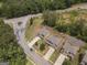 Aerial view of a neighborhood featuring well-maintained lawns, houses, and landscaping at 1001 Hartwell Rd, Locust Grove, GA 30248