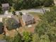 Aerial view of the back of a house with a well-maintained lawn surrounded by lush greenery at 1001 Hartwell Rd, Locust Grove, GA 30248