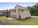 Backyard of a two-story home featuring a concrete patio, lawn, and neutral siding; well-maintained property at 1001 Hartwell Rd, Locust Grove, GA 30248