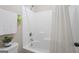 Full white shower with a shower curtain, head and towel rack, and a neutral wall color at 1001 Hartwell Rd, Locust Grove, GA 30248