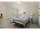 Cozy bedroom with natural light from window, soft carpet and light colored walls; accented by white furniture at 1001 Hartwell Rd, Locust Grove, GA 30248