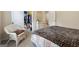 Bedroom featuring a wicker bed frame and a walk-in closet with open door at 1001 Hartwell Rd, Locust Grove, GA 30248
