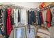 Walk-in closet featuring wire shelving, rods for hanging clothes, and personal decor at 1001 Hartwell Rd, Locust Grove, GA 30248
