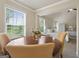 Bright dining nook with table seating, leading to the main bedroom with its neutral walls and decor at 1001 Hartwell Rd, Locust Grove, GA 30248
