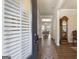 Inviting entryway featuring wood floors, a grandfather clock, and an open view to the dining room at 1001 Hartwell Rd, Locust Grove, GA 30248