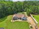 Expansive property featuring a well-maintained lawn, mature trees, and a private backyard pool area at 1422 New Holland Cir, Mcdonough, GA 30252