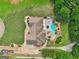 Lush backyard featuring a freeform pool, patio area, and mature trees for added privacy at 1422 New Holland Cir, Mcdonough, GA 30252