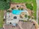 Private backyard oasis featuring a unique pool, patio area, and meticulous landscaping at 1422 New Holland Cir, Mcdonough, GA 30252