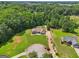 Aerial view of home nestled within a lush landscape, boasting a private backyard oasis and proximity to surrounding nature at 1422 New Holland Cir, Mcdonough, GA 30252