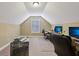 Finished attic area with multiple work spaces and comfortable seating at 1422 New Holland Cir, Mcdonough, GA 30252