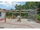 A spacious concrete patio with wooden pergola and outdoor kitchen at 1422 New Holland Cir, Mcdonough, GA 30252