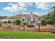 Fenced backyard features a swimming pool, outdoor dining area, and meticulously maintained landscaping at 1422 New Holland Cir, Mcdonough, GA 30252