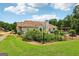 Large fenced backyard, showcasing lush lawn, pool, and an outdoor dining area for enjoyment at 1422 New Holland Cir, Mcdonough, GA 30252