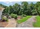 Backyard has a pool, shed, outdoor seating and multiple walking paths at 1422 New Holland Cir, Mcdonough, GA 30252
