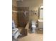 Accessible bathroom featuring a tiled walk-in shower and comfort height toilet at 1422 New Holland Cir, Mcdonough, GA 30252