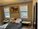 Bedroom featuring two windows and horse art at 1422 New Holland Cir, Mcdonough, GA 30252
