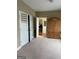 Neutral bedroom featuring wall closet and wardrobe with doorway to another room at 1422 New Holland Cir, Mcdonough, GA 30252