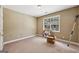 Cozy bedroom features neutral walls, carpet, a window, and a spacious layout at 1422 New Holland Cir, Mcdonough, GA 30252