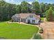 Lovely ranch-style home with mature landscaping, a spacious yard, and a charming covered entry at 1422 New Holland Cir, Mcdonough, GA 30252