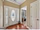 Elegant foyer featuring hardwood floors and a decorative front door with sidelights at 1422 New Holland Cir, Mcdonough, GA 30252