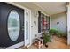 Cozy front porch with ample seating and decorative plants, perfect for relaxation at 1422 New Holland Cir, Mcdonough, GA 30252