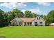 Traditional home with a well-manicured lawn and charming curb appeal at 1422 New Holland Cir, Mcdonough, GA 30252