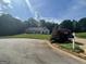 Charming one-story home with well-manicured front yard and mature trees at 1422 New Holland Cir, Mcdonough, GA 30252