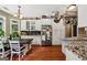 Bright kitchen featuring white cabinets, stainless steel appliances, and granite countertops at 1422 New Holland Cir, Mcdonough, GA 30252
