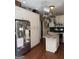 Open kitchen featuring granite countertops, stainless steel appliances, and white cabinets with dark hardware at 1422 New Holland Cir, Mcdonough, GA 30252