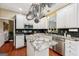 Modern kitchen with a pot rack, stainless steel appliances, and granite countertops at 1422 New Holland Cir, Mcdonough, GA 30252