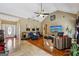 Open living area with mixed flooring types, multiple seating areas, and neutral paint colors at 1422 New Holland Cir, Mcdonough, GA 30252