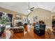 Cozy living room with hardwood flooring, a fireplace, and plenty of comfortable seating at 1422 New Holland Cir, Mcdonough, GA 30252