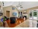 Spacious living room featuring a fireplace, vaulted ceilings, and views of the outdoor pool area at 1422 New Holland Cir, Mcdonough, GA 30252