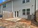 The backyard has a concrete patio, partial fence, and access to the house through sliding glass doors at 3135 Journal Ct, Decatur, GA 30035