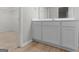 Bathroom featuring a vanity with ample storage and tile flooring, and a walk-in closet at 3135 Journal Ct, Decatur, GA 30035