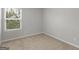 Bedroom with a bright window and neutral carpet at 3135 Journal Ct, Decatur, GA 30035