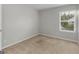 Bedroom with a bright window and neutral carpet at 3135 Journal Ct, Decatur, GA 30035
