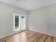 Bedroom with patio access and modern wood-look flooring at 3135 Journal Ct, Decatur, GA 30035